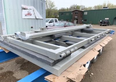 Here is a bi-fold door on this trailer that we blasted, primed, and powder coated 02