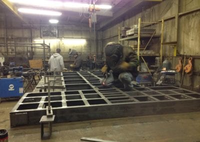 Welding the base of a Precast Mold on our 10 x 30 fixturing table that weigh s 30,000#